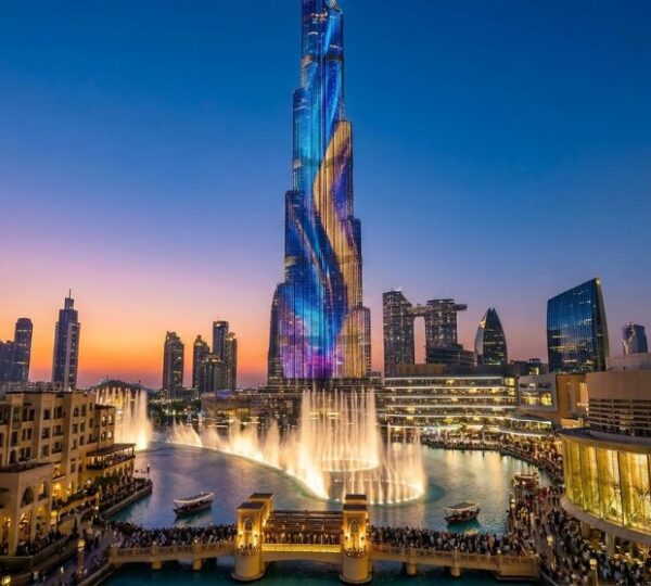 Burj Khalifa tower and Dubai Fountain show at sunset, a top layover stop in Dubai
